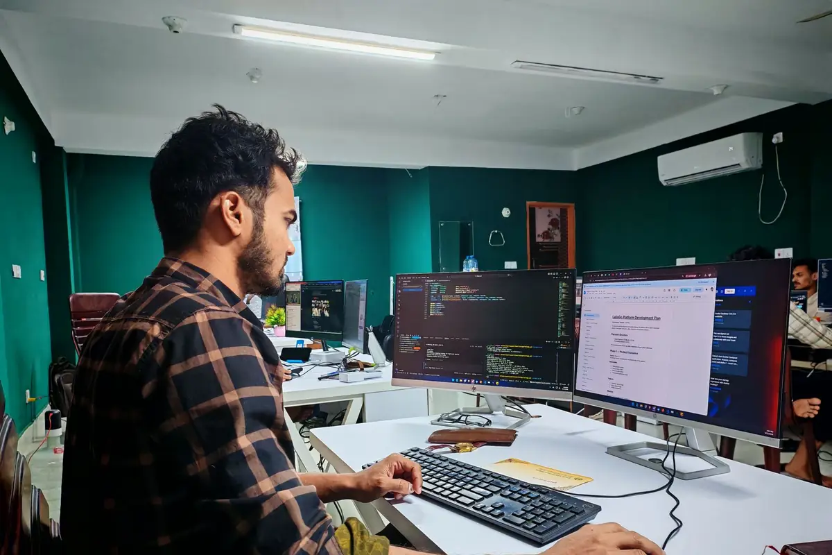 Developer building an automation across a multi-monitor workstation