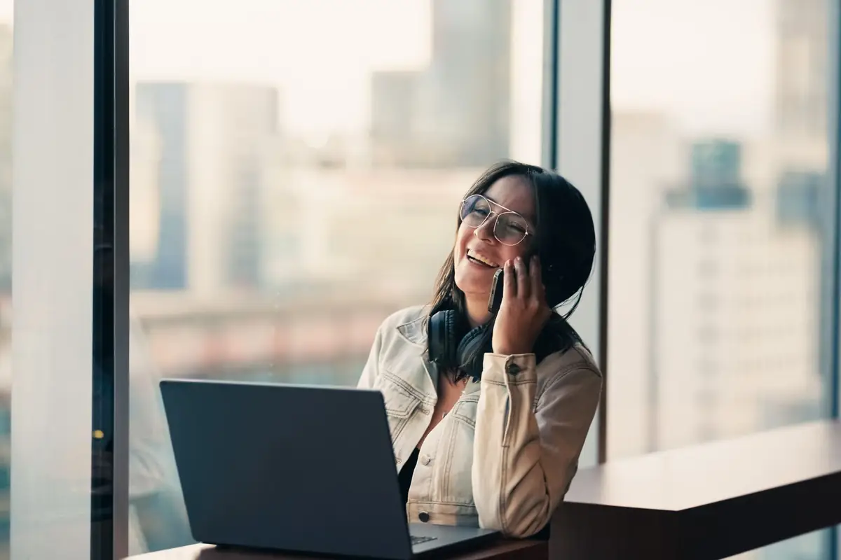 Woman reviewing an automated workflow on her laptop